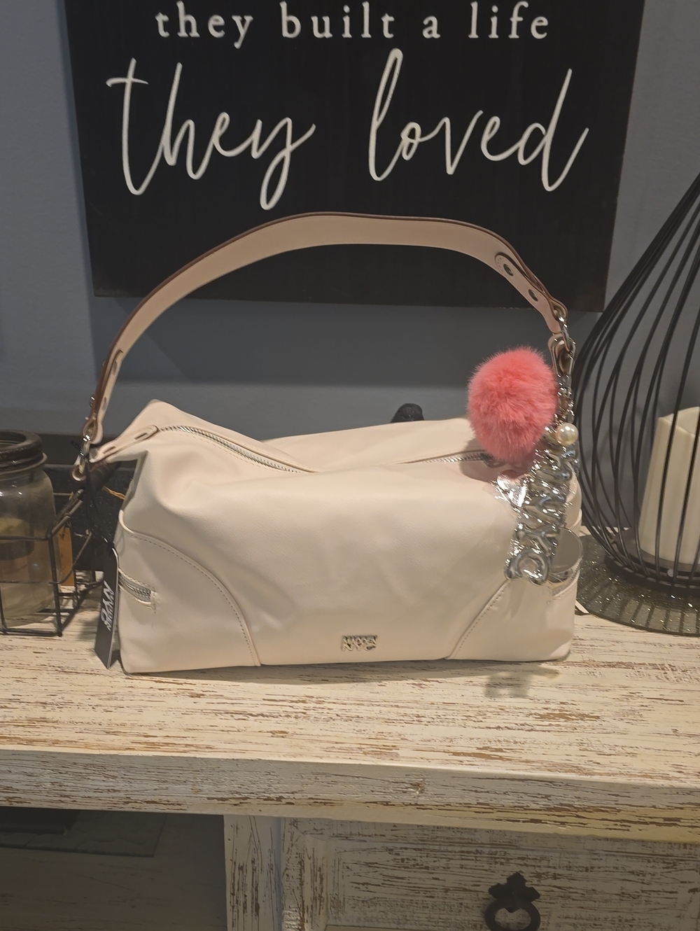 ALDO Cream Shoulder Bag with Pink Pom-Pom Charm